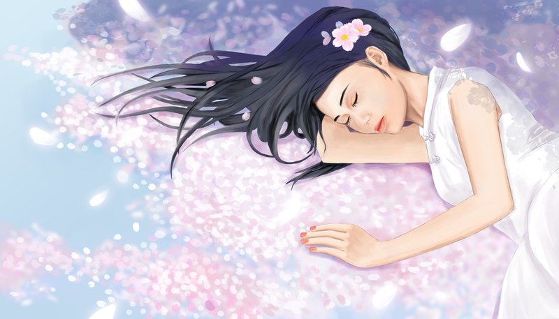 睡在落满樱花的地上的小女孩