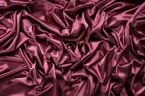 紫红色丝绸布料护肤品背景