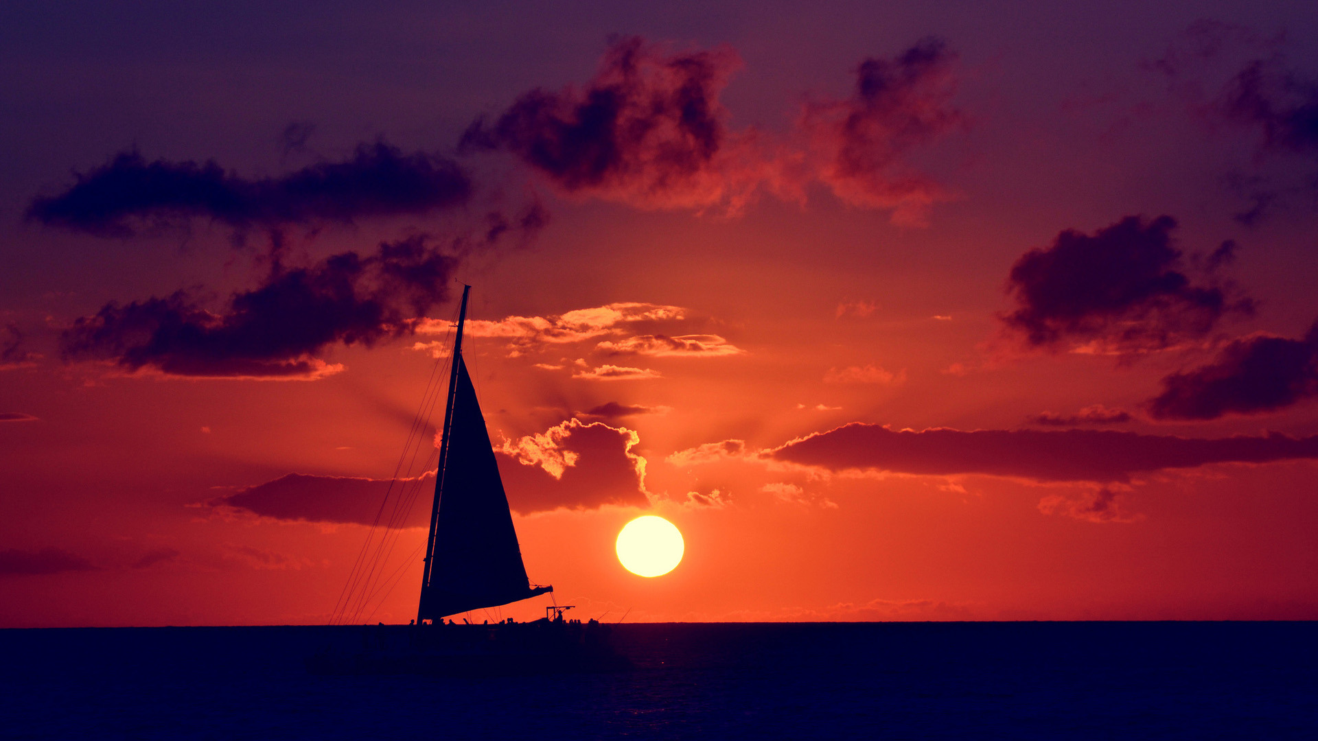 夕阳大海帆船风景桌面壁纸