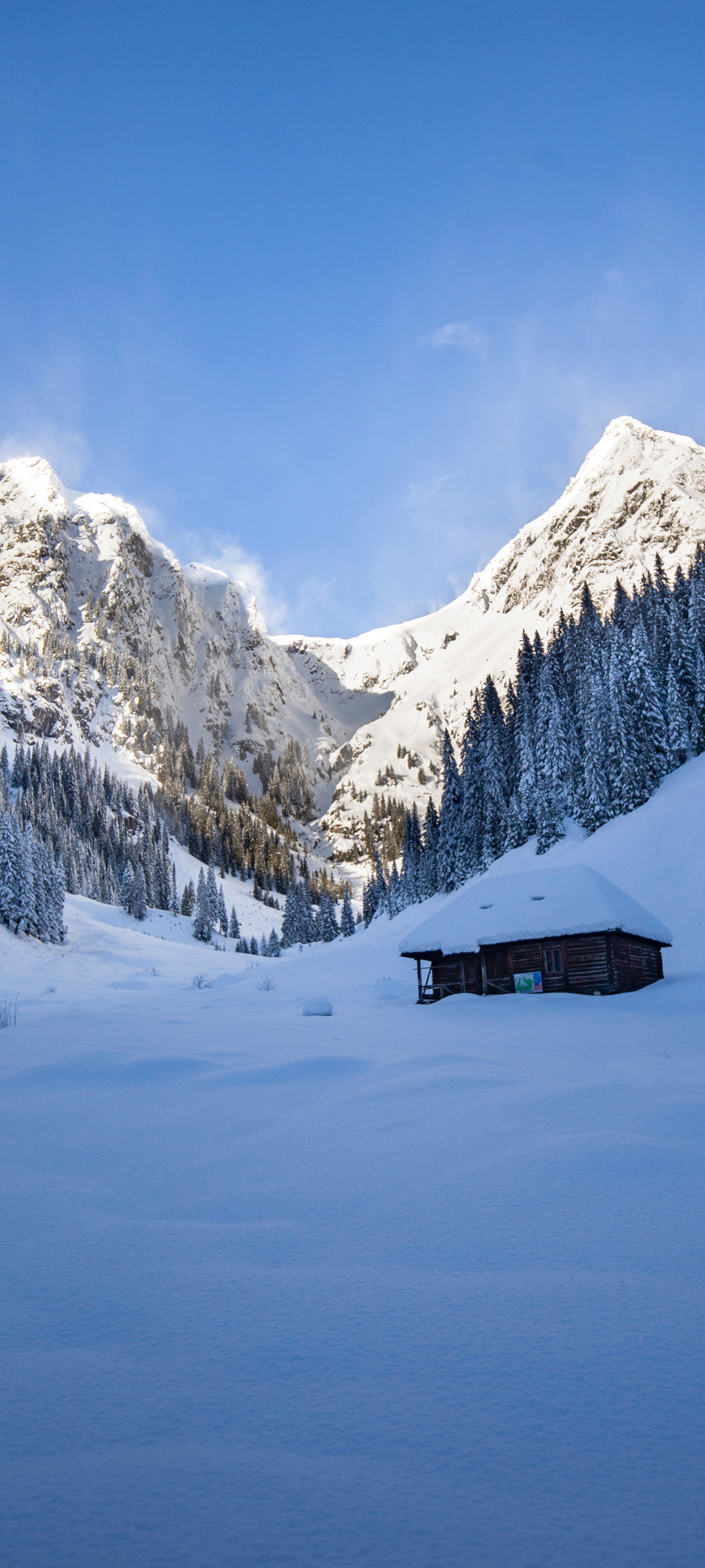 雪山下的小木屋风景手机背景图
